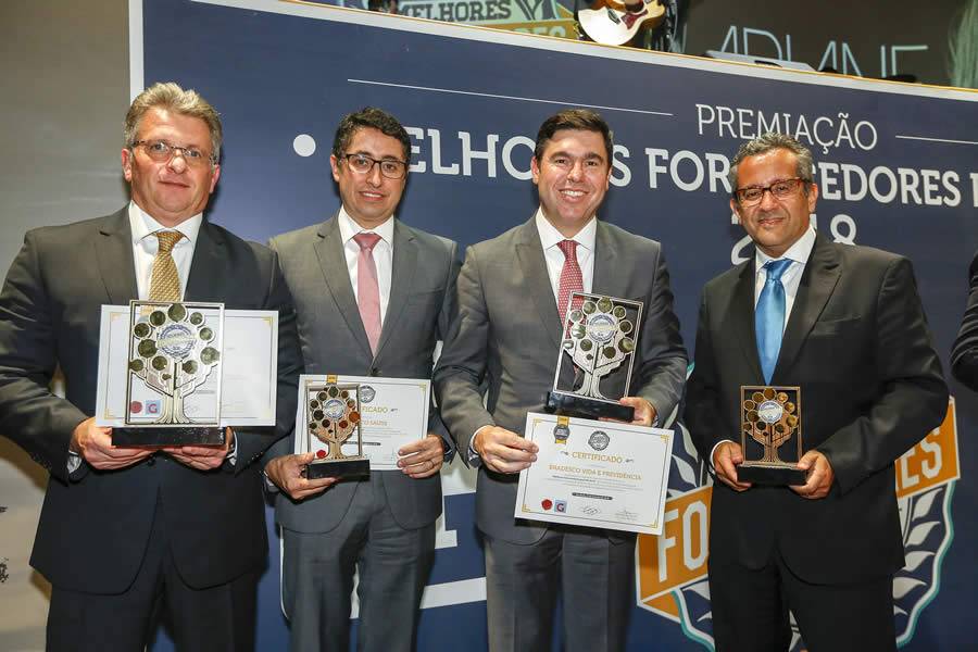 Legenda da Imagem: (Da esq. para a dir.) Representando o Grupo Bradesco Seguros, os Superintendentes-Executivos Marco Antonio Soncii, Rodrigo Moreno, Marcelo Rosseti e Marcelo Dias